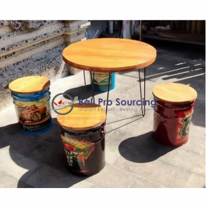 A Set Of Table And Recycled Drum Chairs